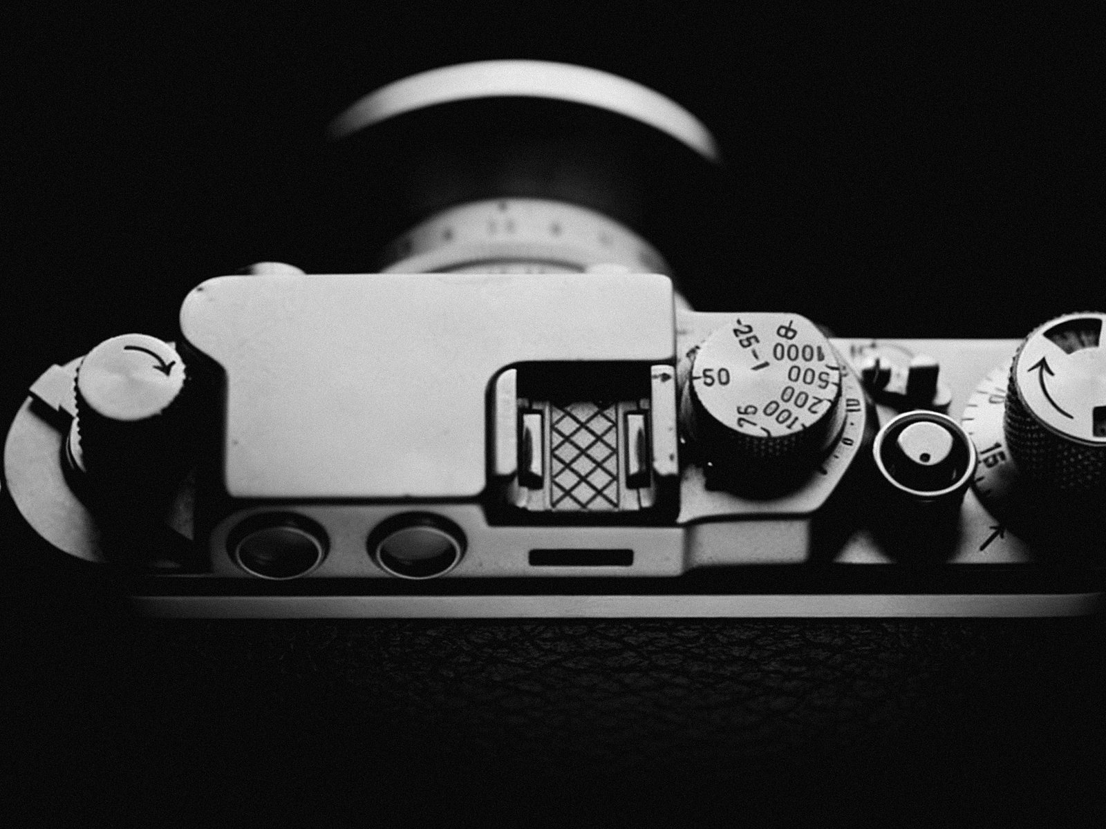 Hands adjusting a camera dial